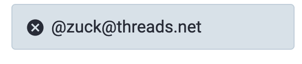 A text box with a small x in a circle at the left followed by the text "@zuck@threads.net"