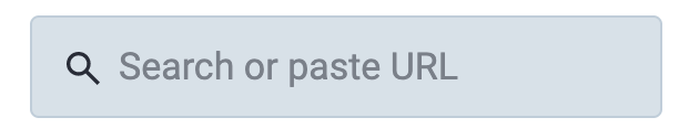 A text box with a small icon of a magnifying glass and the words "Search or paste URL"