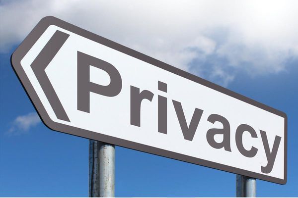 A road sign shaped like an arrow with the word "Privacy" on it